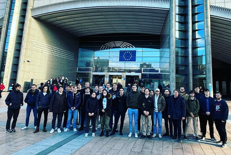 Us in front of the building