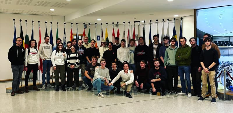 Us in front of EU flags